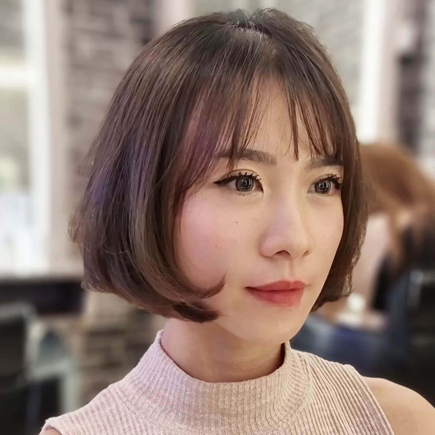 Short polished bob with sleek see-through bangs