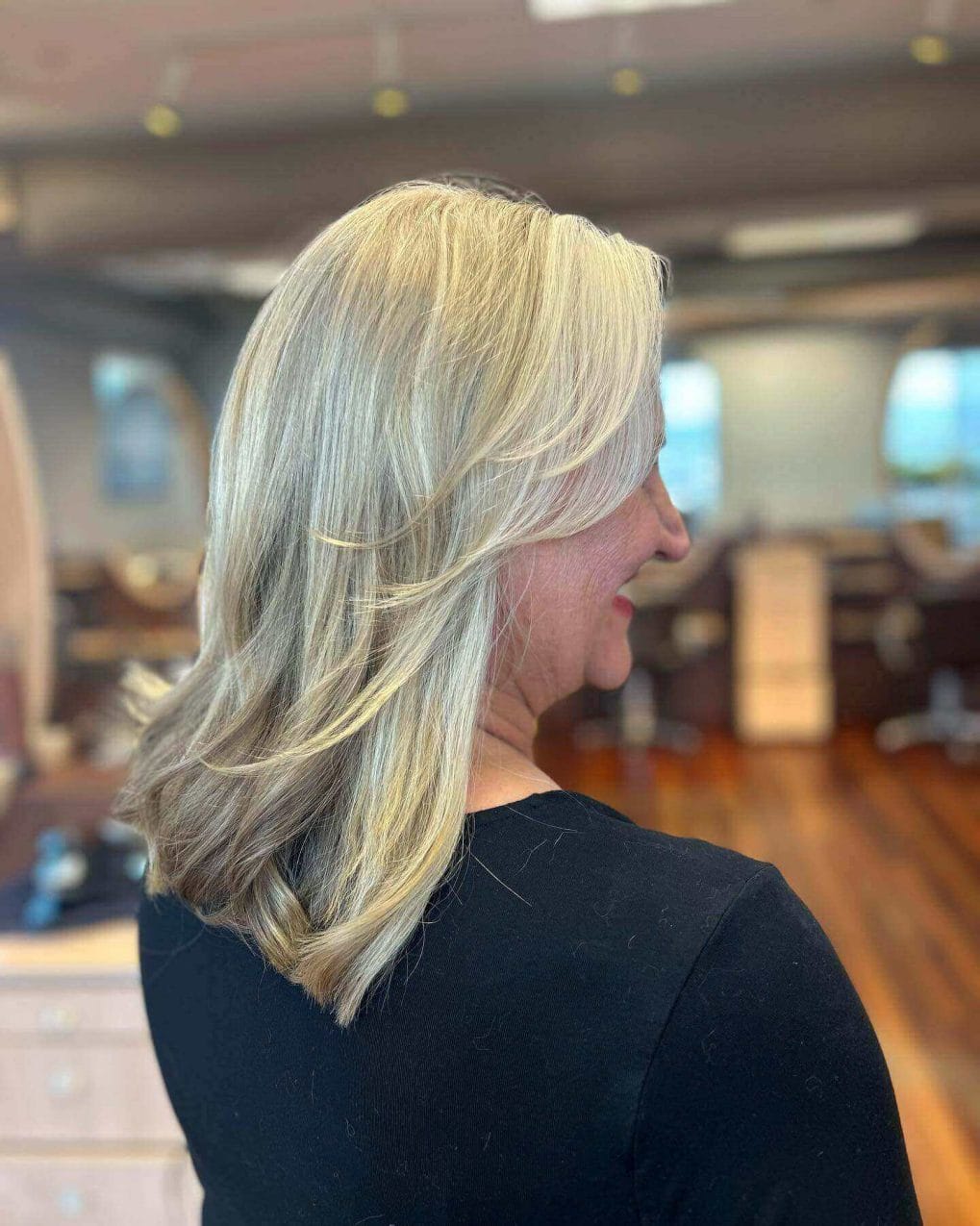 Platinum and blonde blend in a graceful medium-length hairstyle.