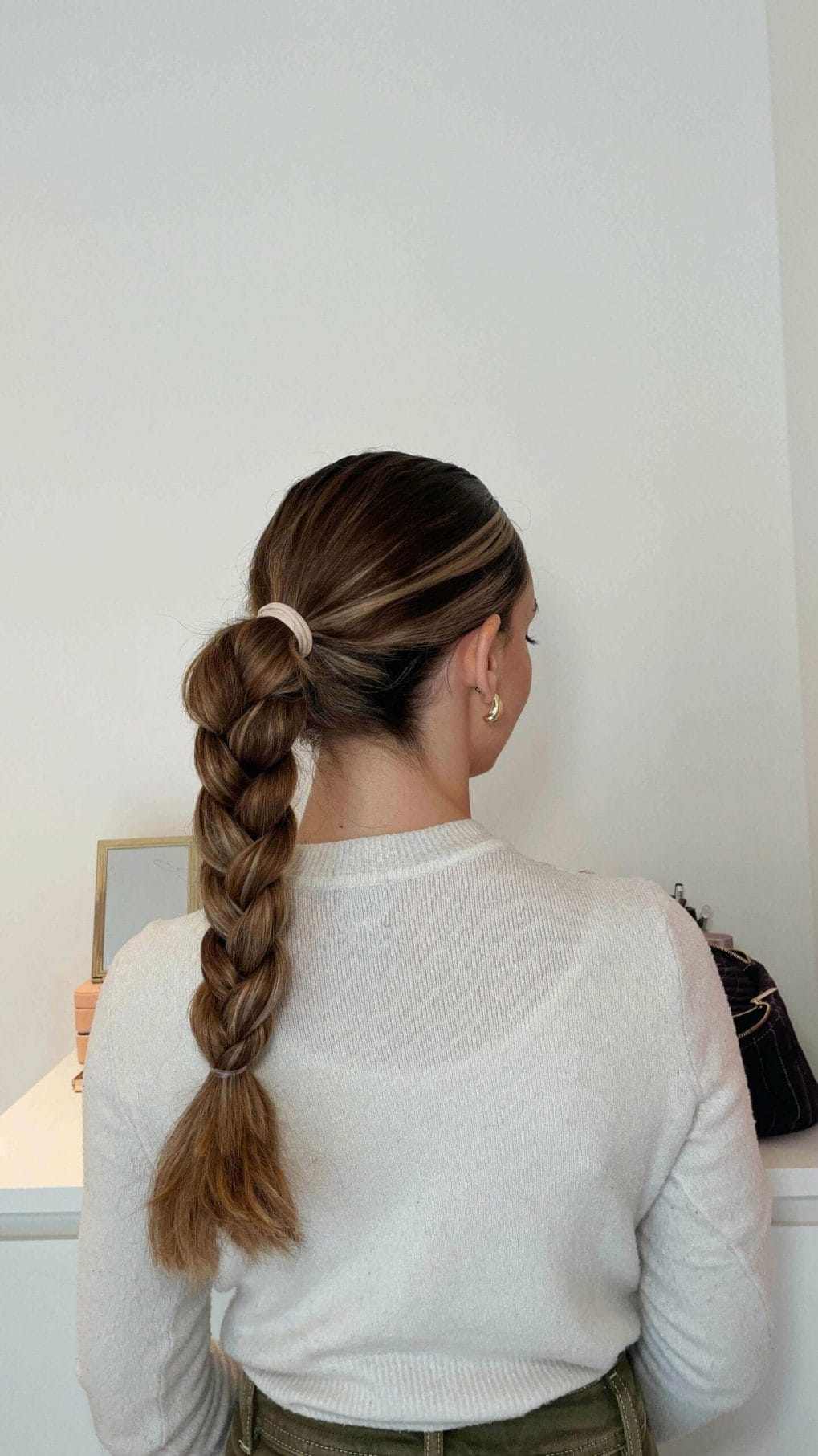 Polished ponytail with a playful braid showing off an ombre for softball