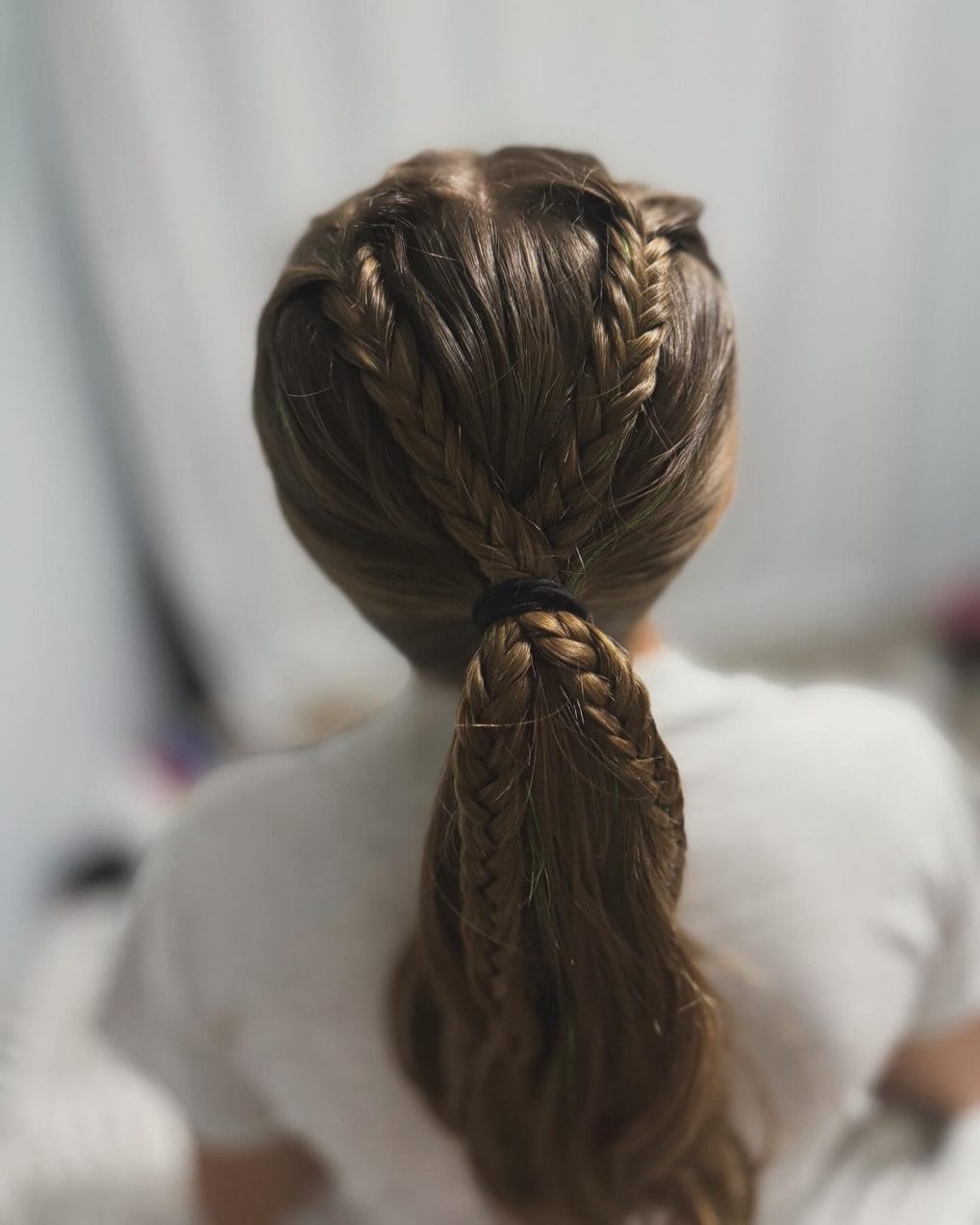 Practical braid wrapped into a ponytail for active dancers