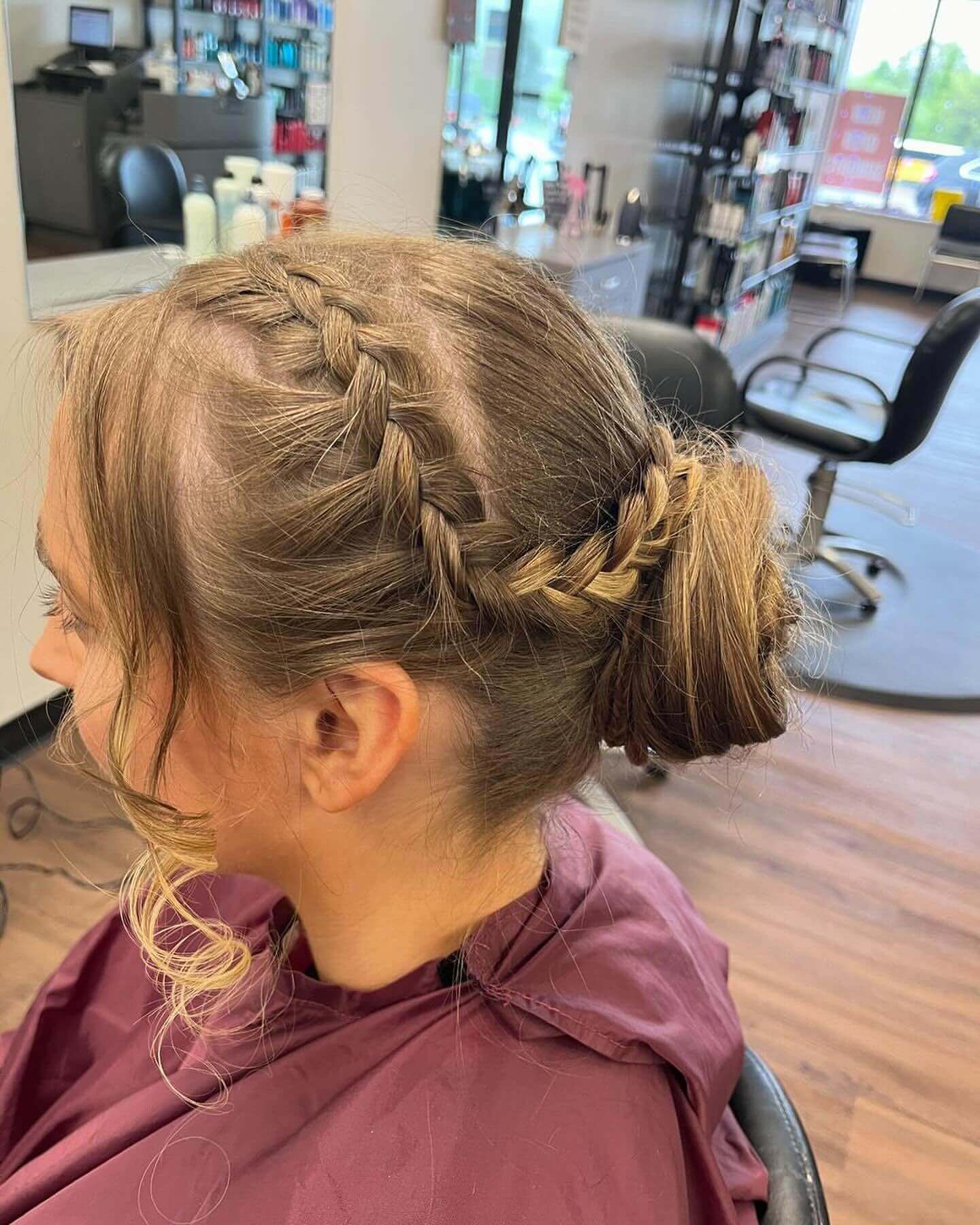 Intricate updo with braid and loose curls