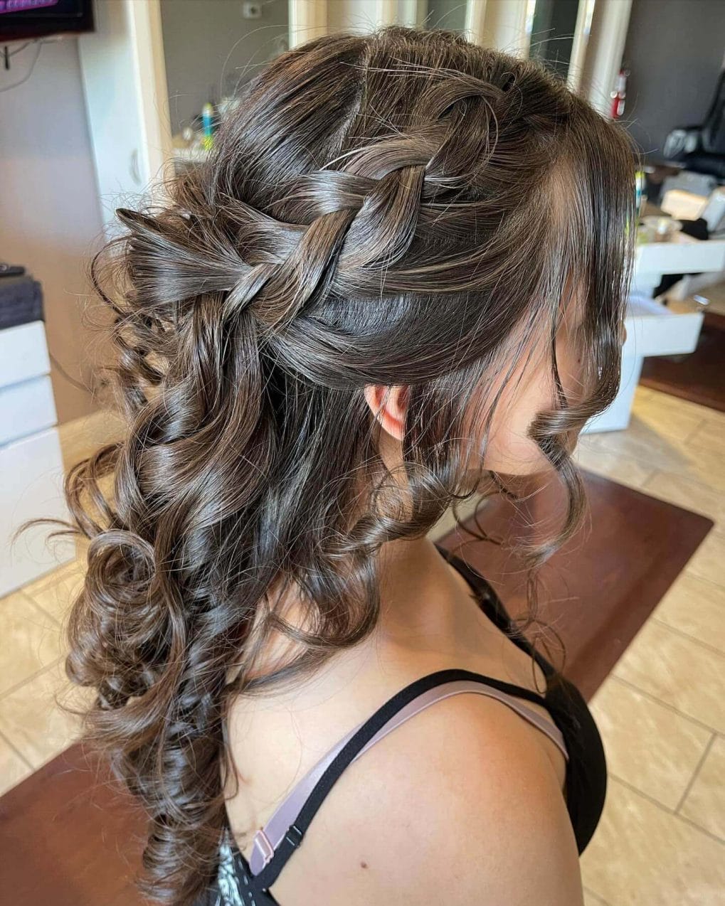 Dark curls with side braid and loose tendrils
