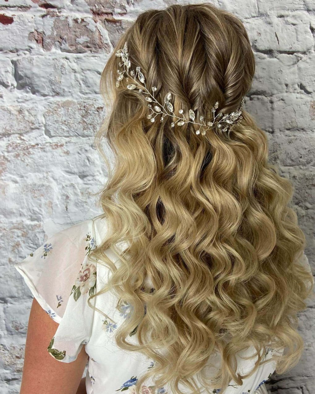 Golden blonde curls with leafy hairpiece