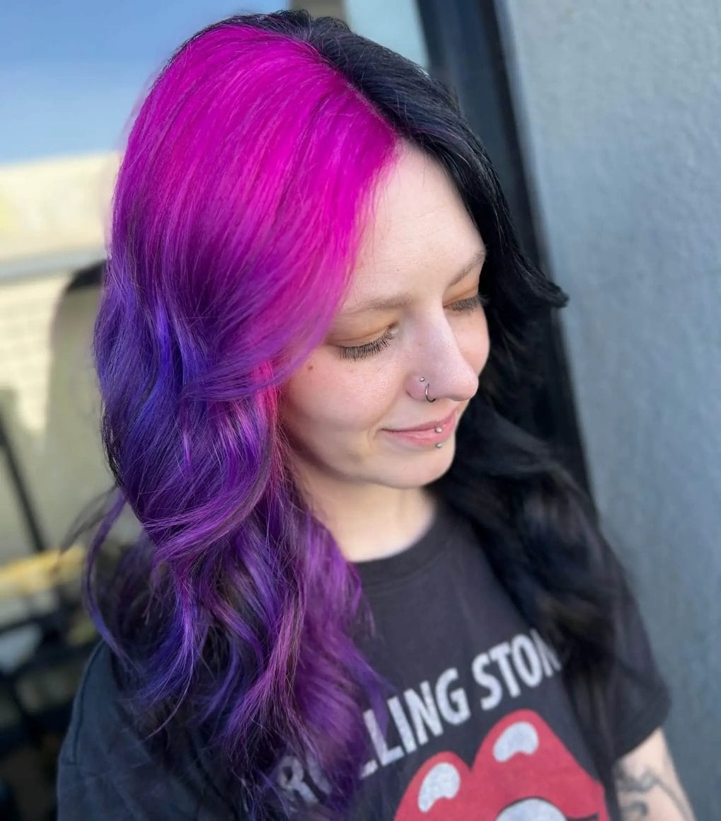 Vivid purple to pink gradient on layered waves with side-swept bangs