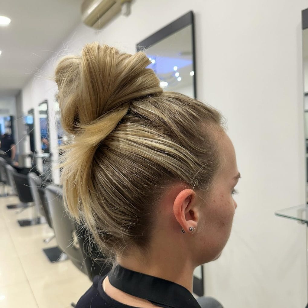 Casual chic high bun with cool root contrast