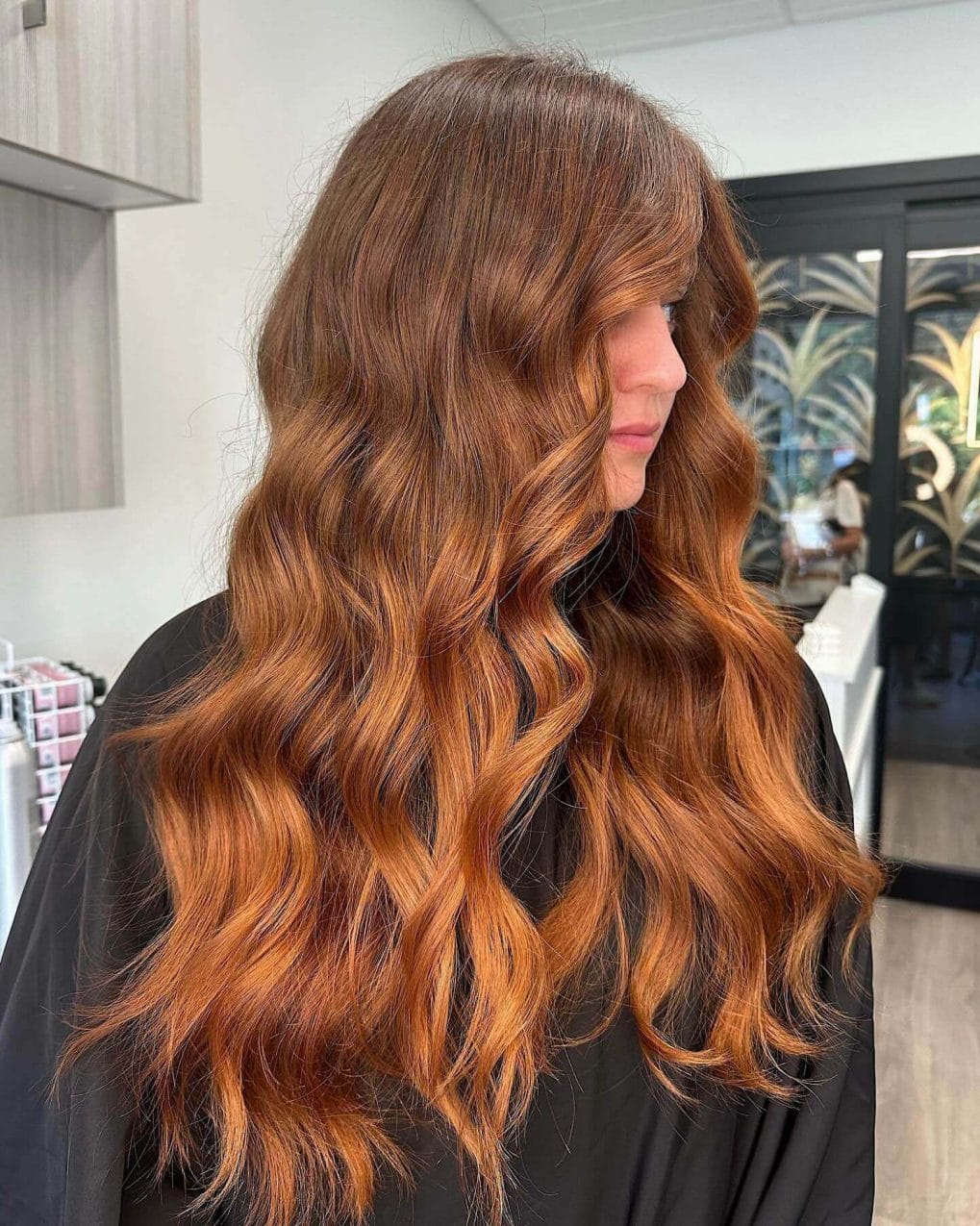 Romantic wavy copper hair with side bangs