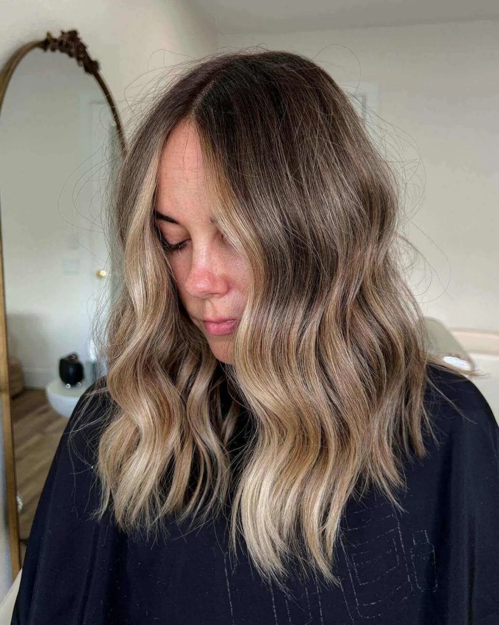 Shoulder-length cut with sun-kissed and blended highlights