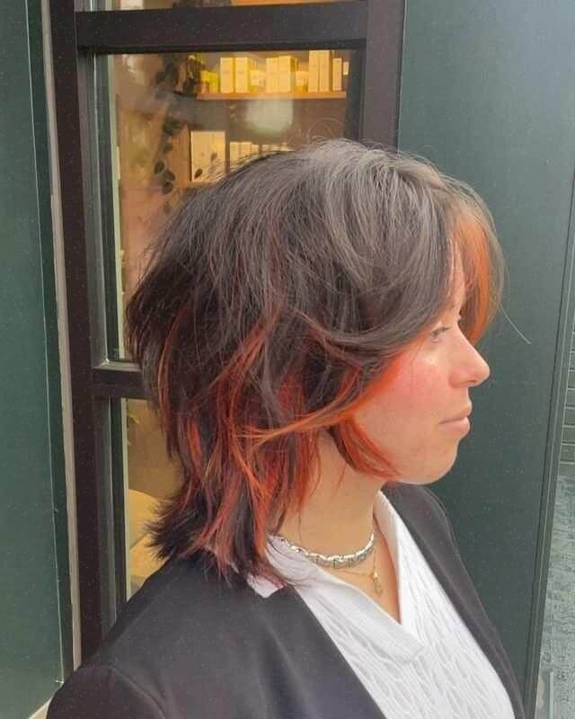 Shaggy voluminous bob with vibrant curtain bangs