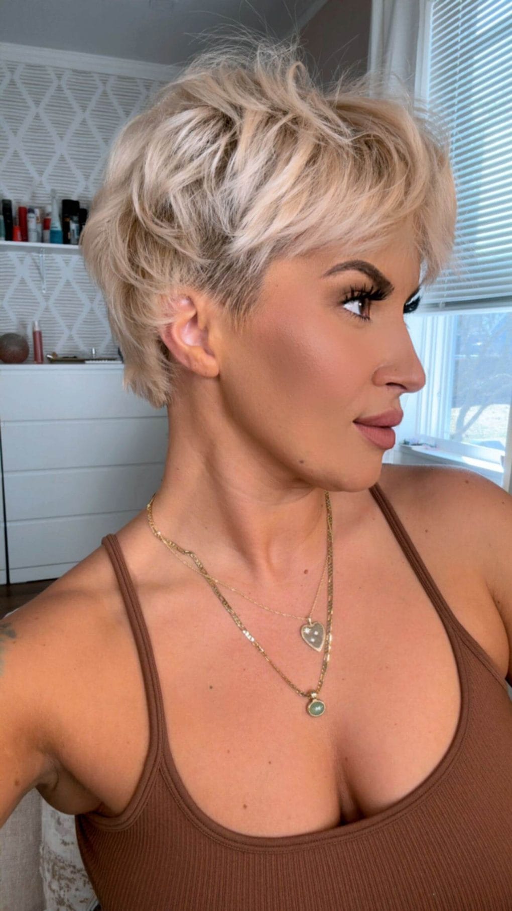 Pixie haircut with textured top and neatly trimmed nape