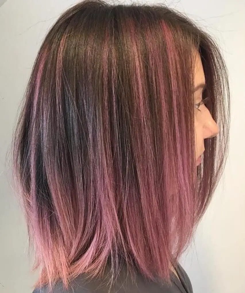 Chic ombre fusion of natural undertones with pops of pink at shoulder length.