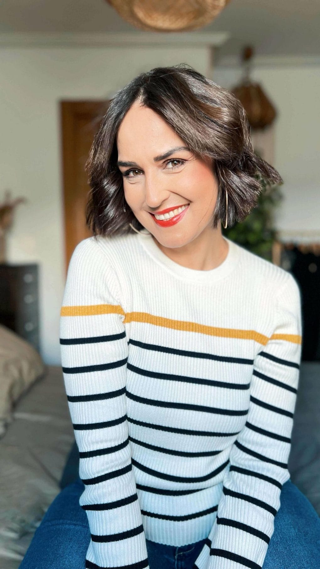 Shoulder-length bob with subtle waves and dark brown hue