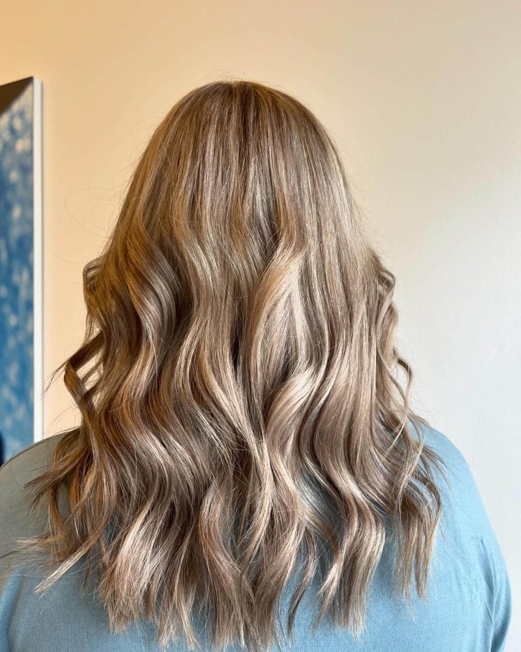 Shoulder-length waves with cool blonde and light brown balayage