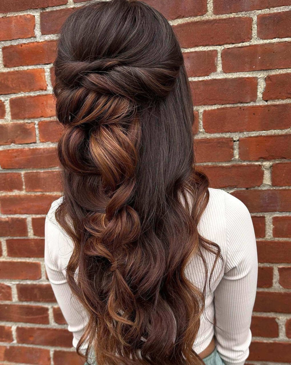 Graceful side-swept braid merges into voluminous dark waves