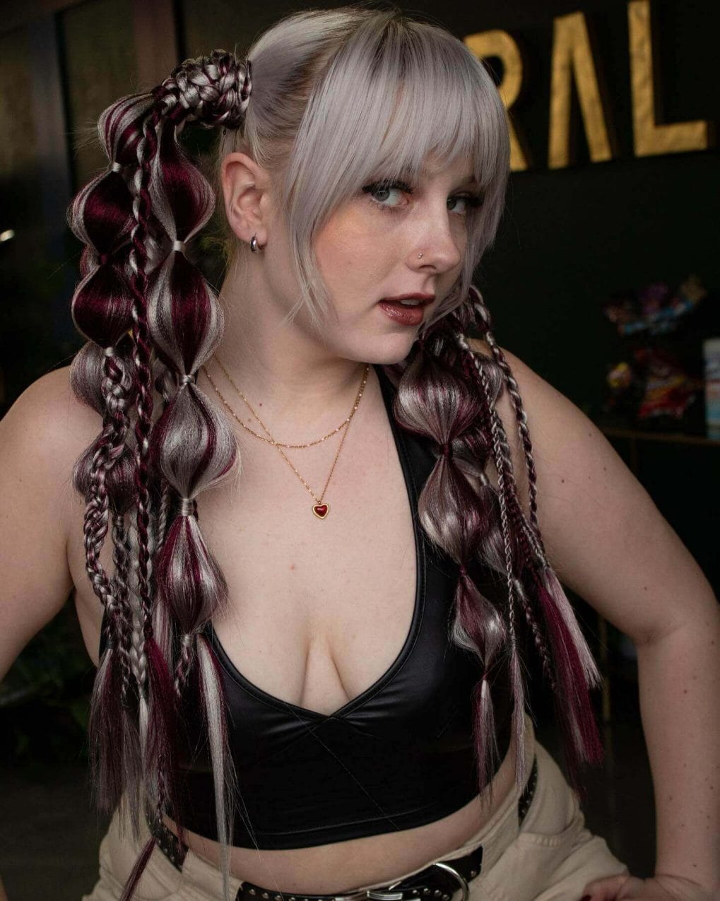 Sophisticated silver and burgundy braids with a side updo and loose waves