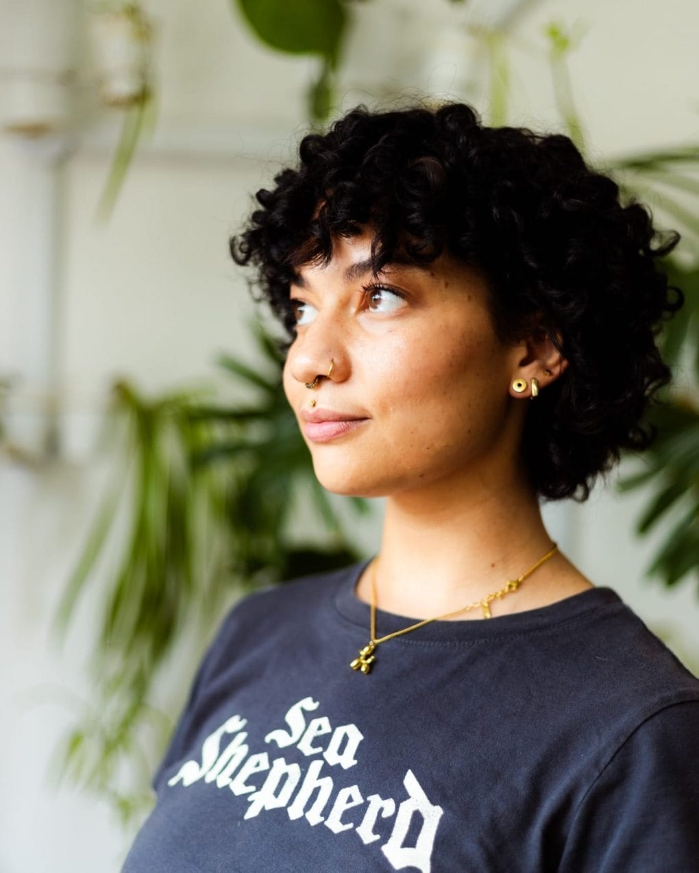 Simple elegance in dark curly pixie with gentle face framing