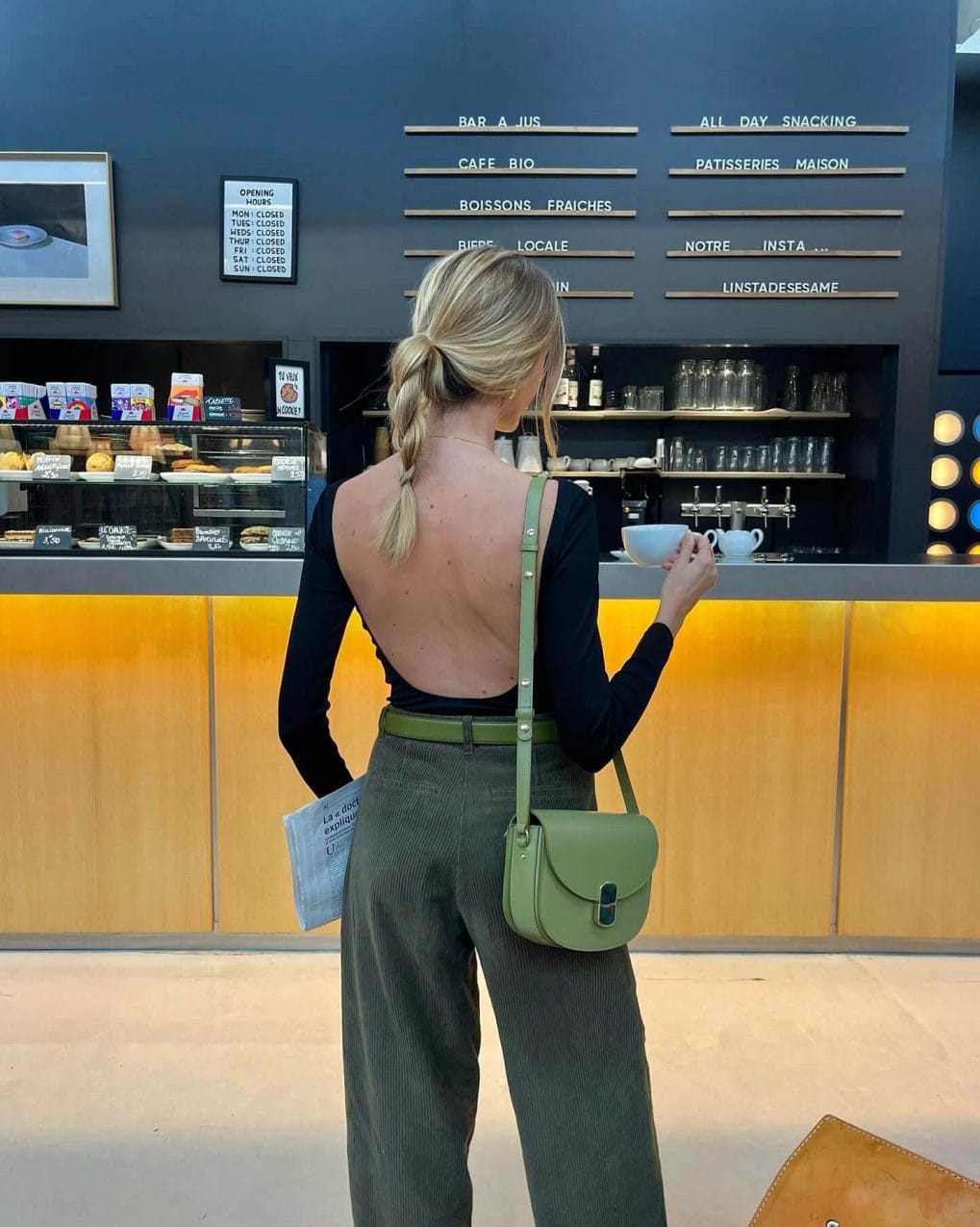 Straightforward low ponytail with textured twist for summer practicality