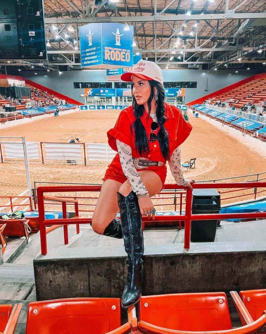Sleek, side-parted black hair complements cowgirl's confident look