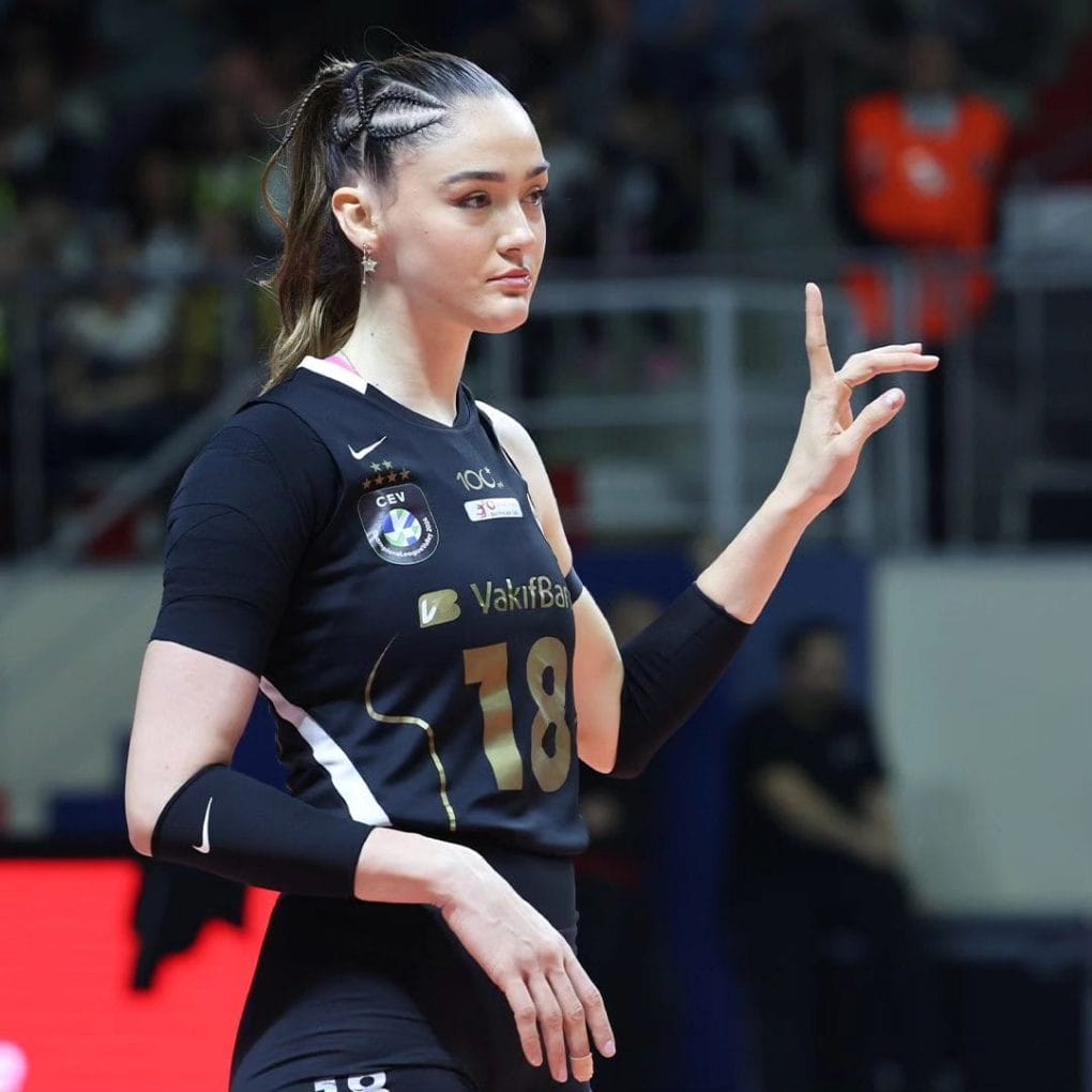 Raven-black hair in sleek cornrows with free-flowing length for volleyball agility