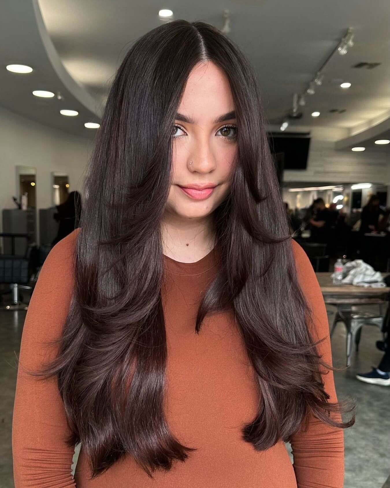Sleek dark layers with curtain fringe 90s style
