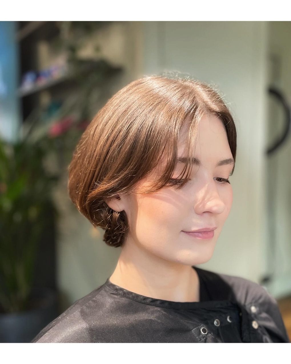 Sleek French bob with elegant side part