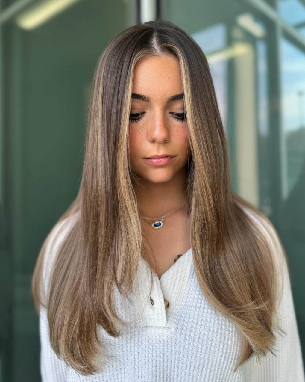 Long sleek hairstyle with subtle layers for thicker look