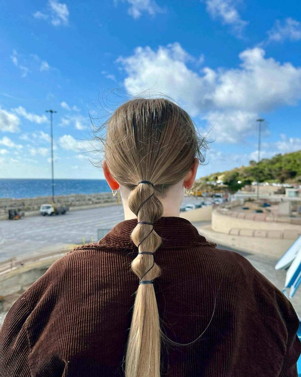 Volleyball-ready sleek low ponytail