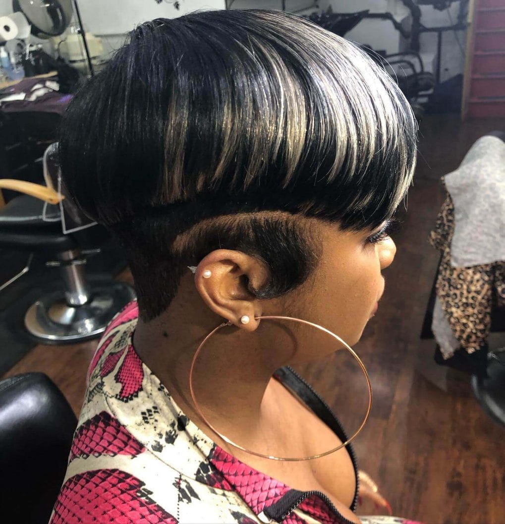 Elegantly redefined mushroom cut with sleek rounded fringe and bold undercut.