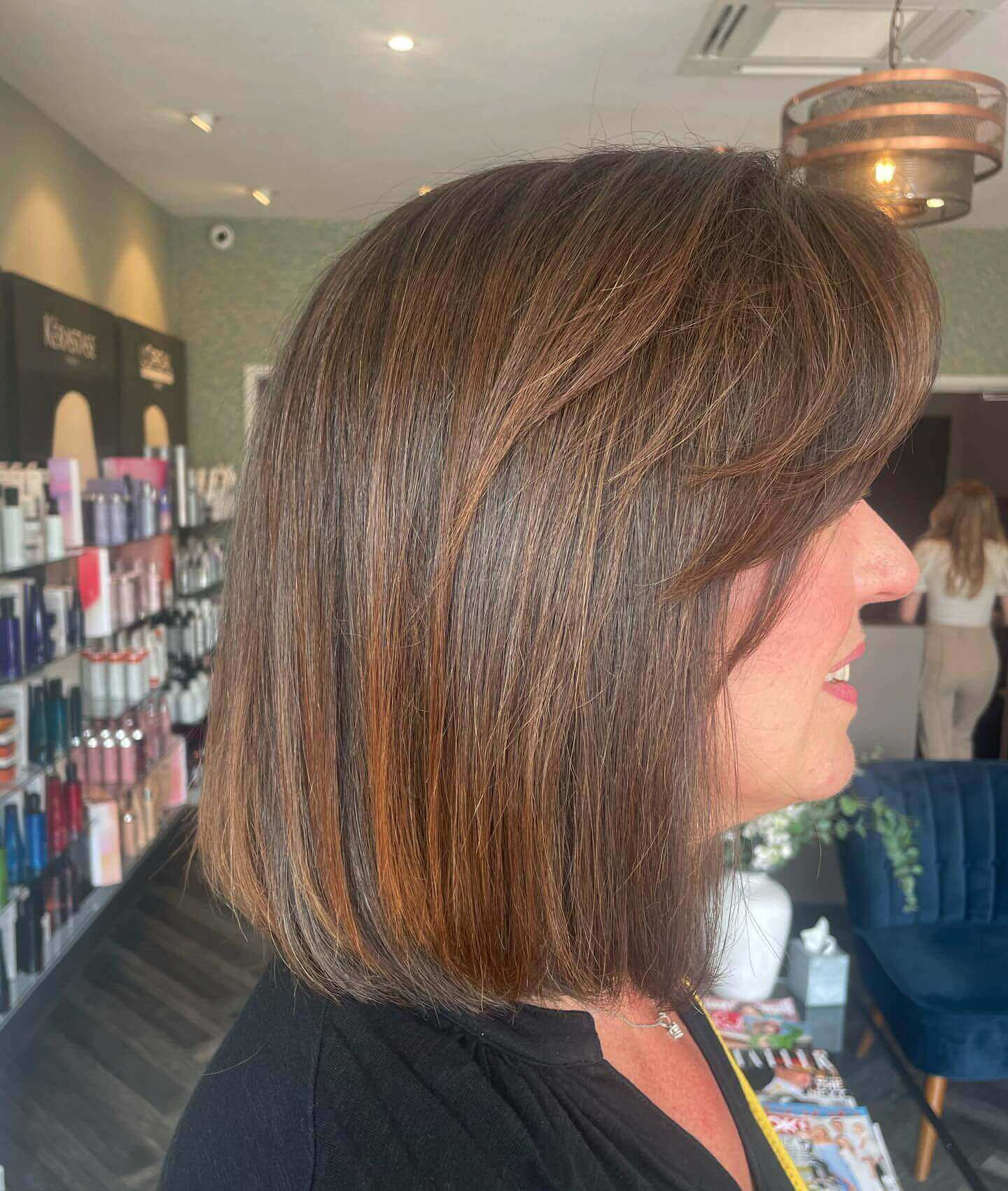 Sleek shoulder-length bob with side-swept bangs