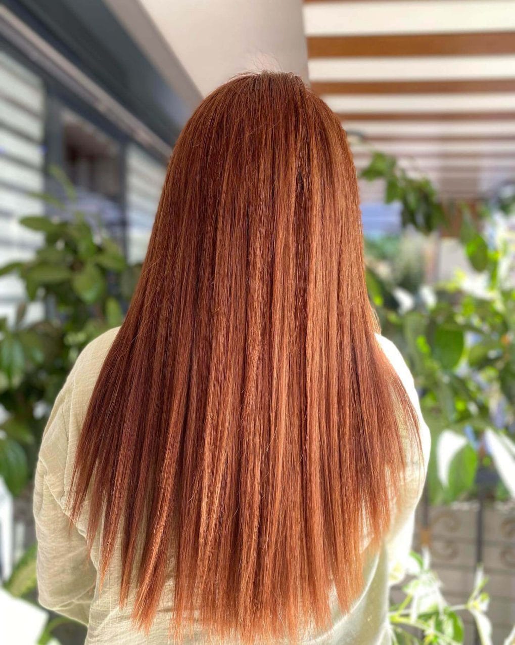 Sleek straight copper hair for striking appearance