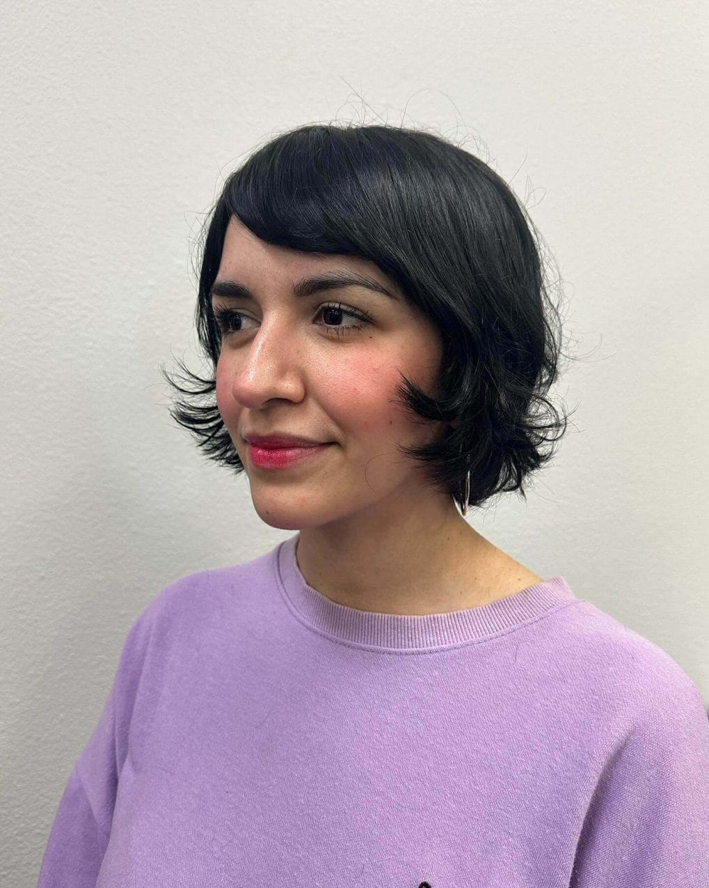 Sleek, straight French bob with jet-black hue