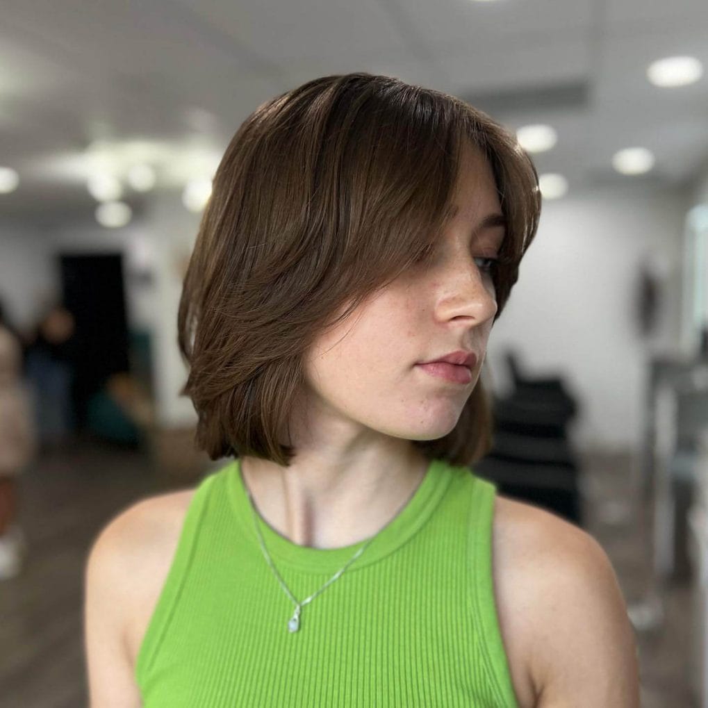 Smooth layered bob with stylish curtain bangs