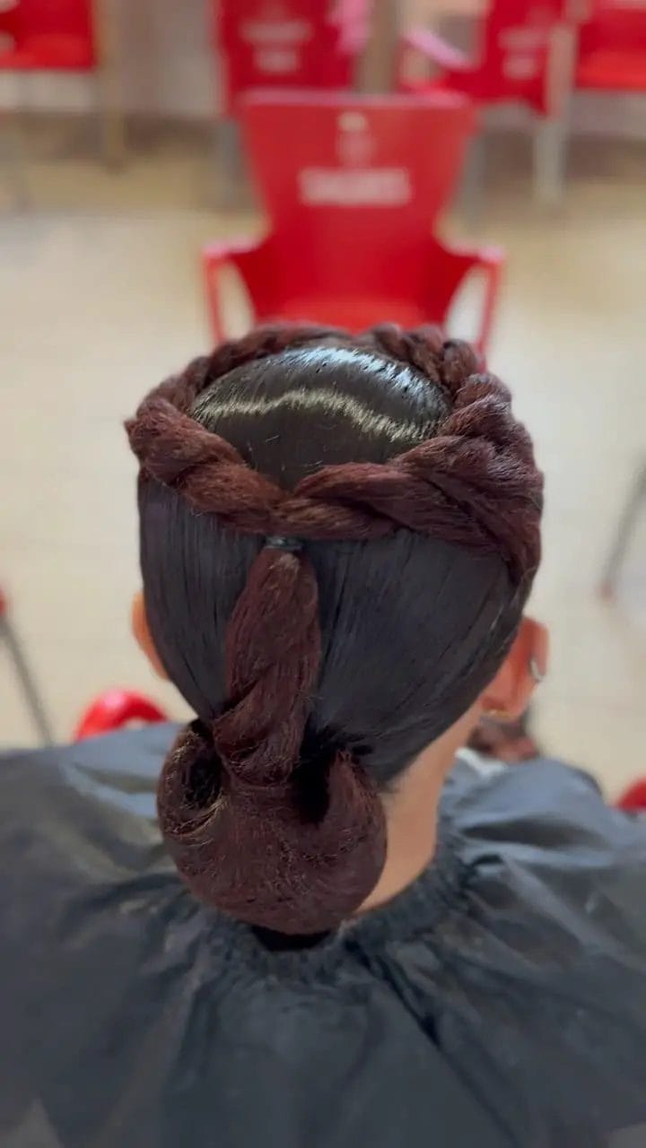 Elegant low bun with contrasting smooth top and braids
