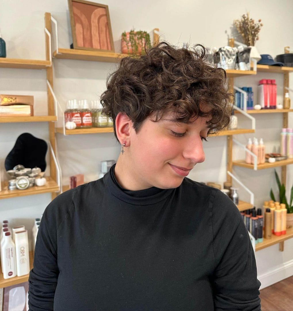 Soft bob with tapered nape and natural brown curls.