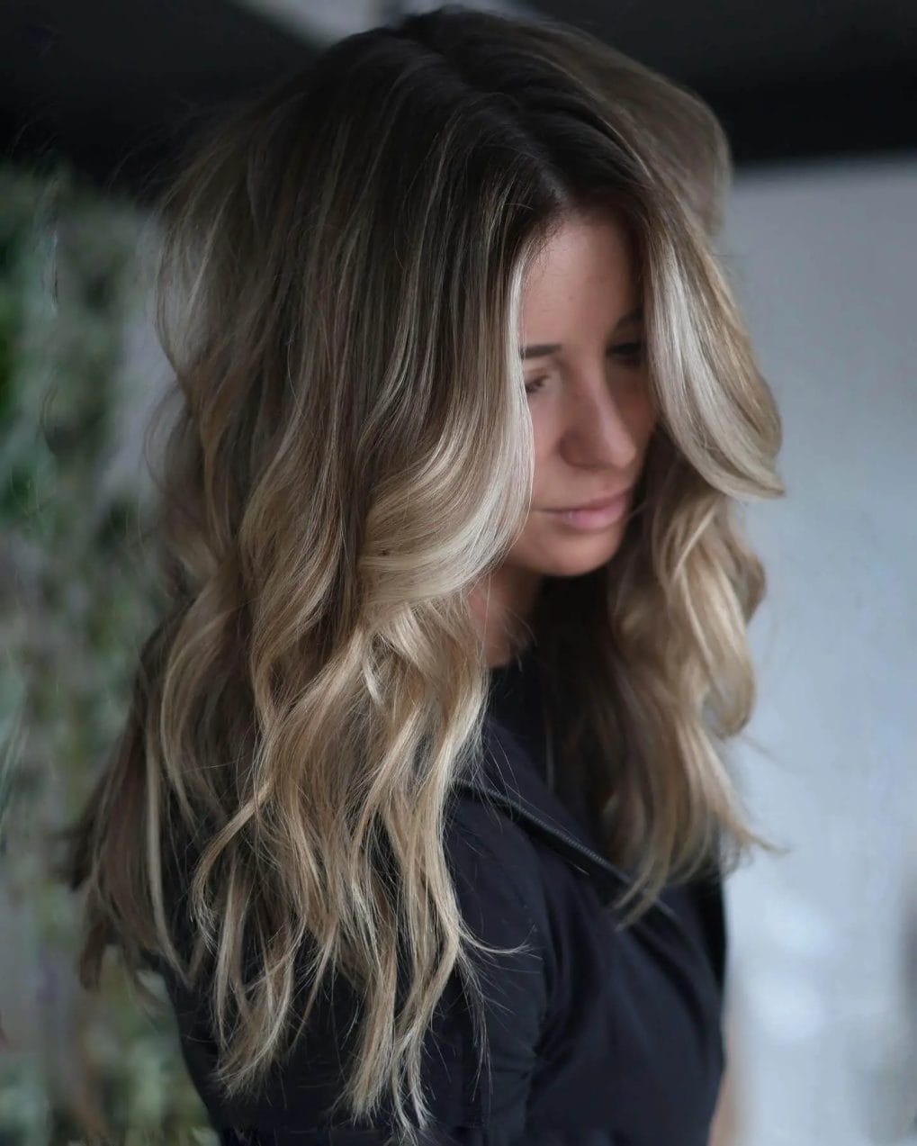 Long soft brown waves with subtle face-framing highlights