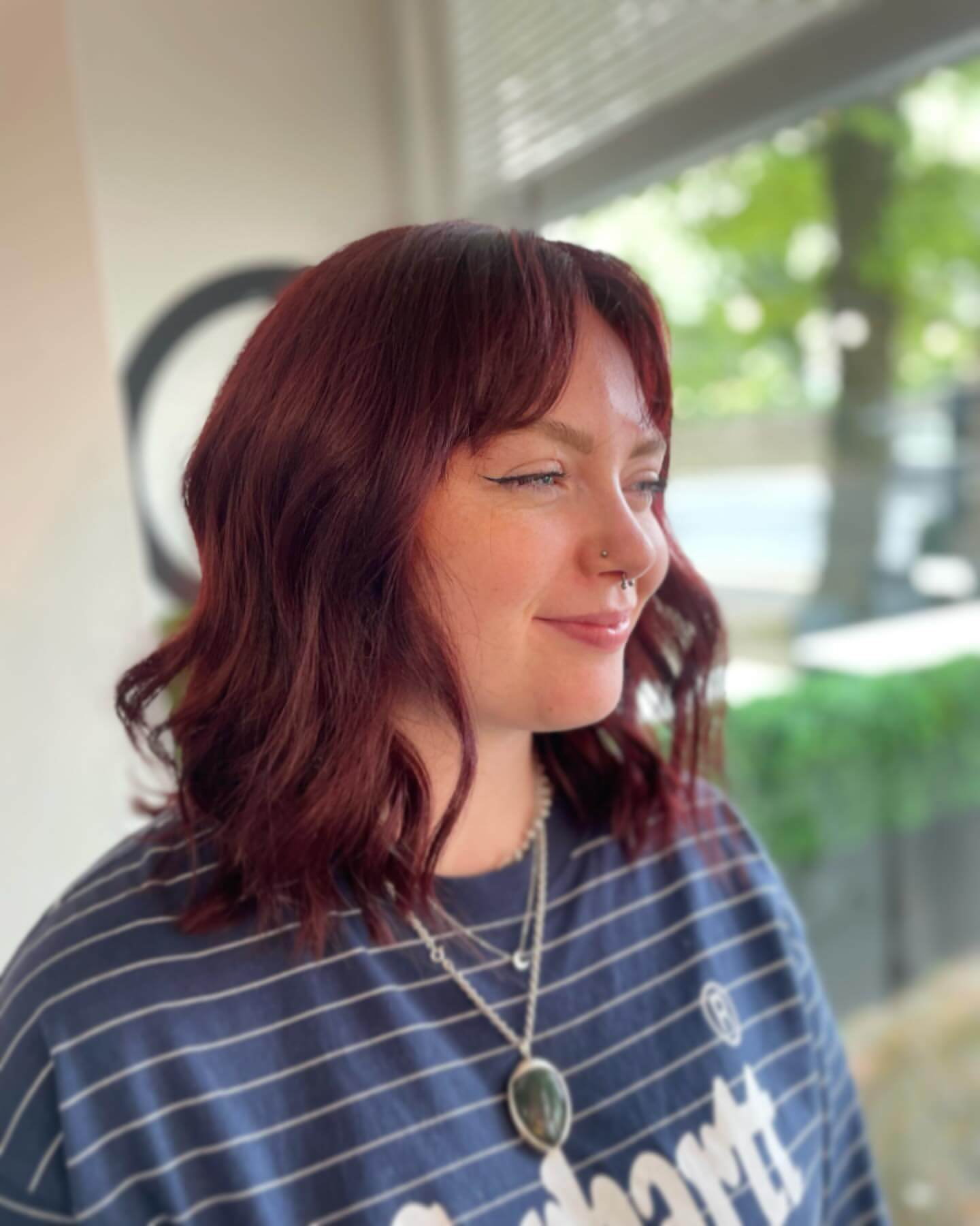 Soft wavy red bob with curtain bangs
