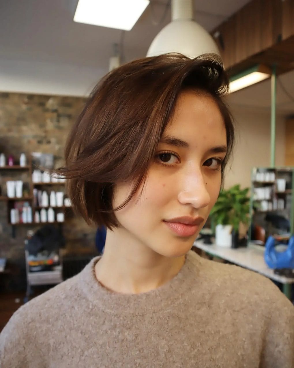Softly rounded '90s bob with a little volume at the back in rich brown