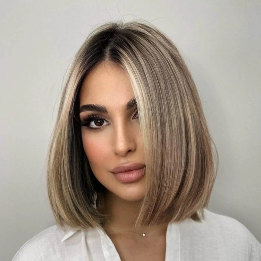 Sophisticated shoulder-length bob with dark to light ombre gradient.