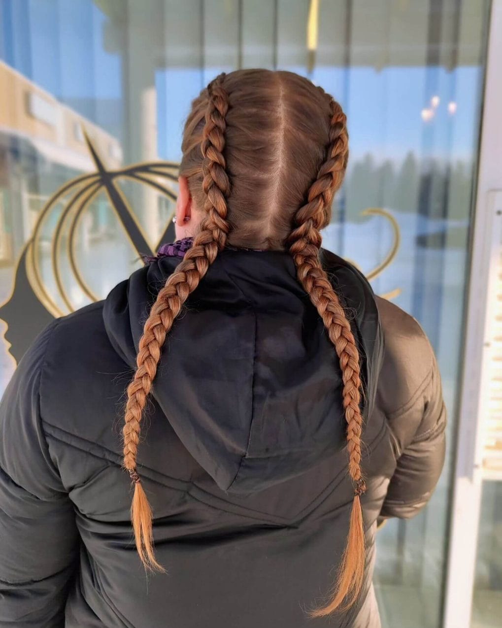 Long, simple straight-back braids in dark red for sports practicality