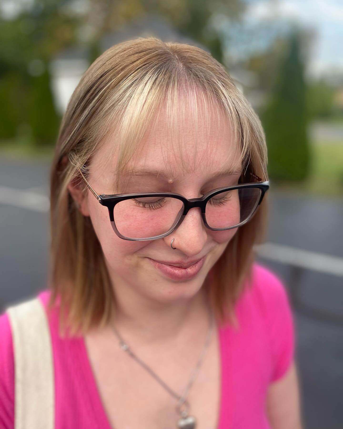 Straight shoulder-length light blonde hair with see-through bangs