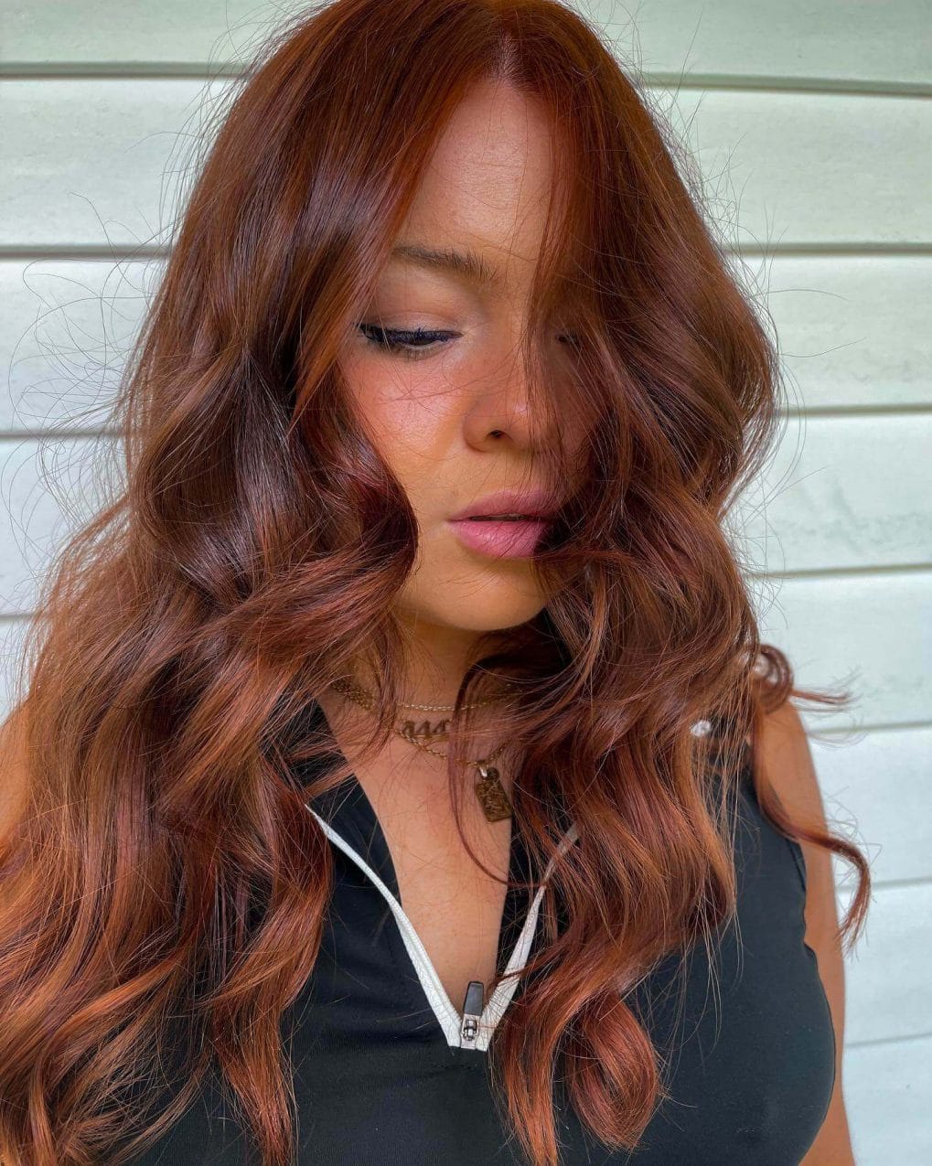 Stunning copper color with shadow root, vibrant tones, and long soft layers.