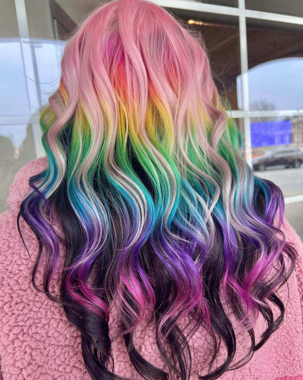 Vibrant rainbow-colored waves blending from pink to purple