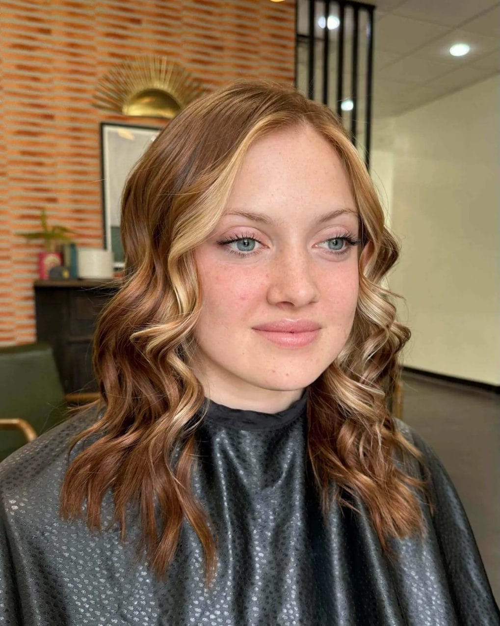 Blonde and light brown waves with sun-kissed front pieces