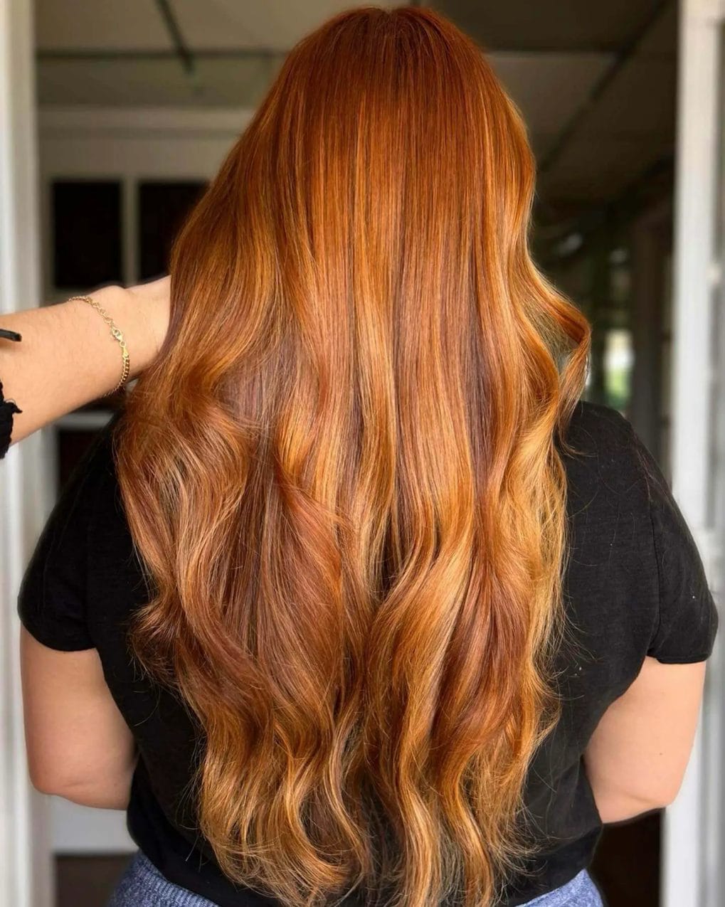Long layers in a sun-kissed copper spectrum with soft waves.