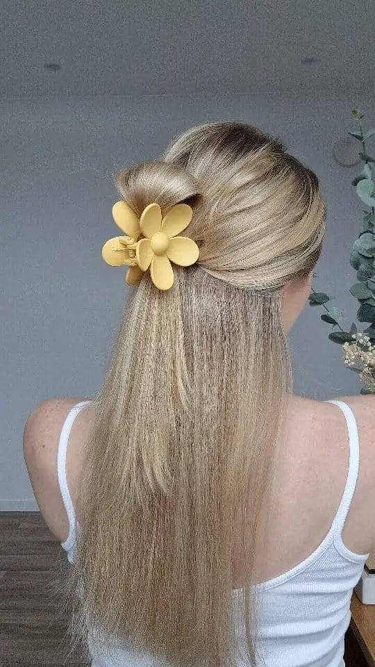 Cheerful long hair with sunny yellow flower clip