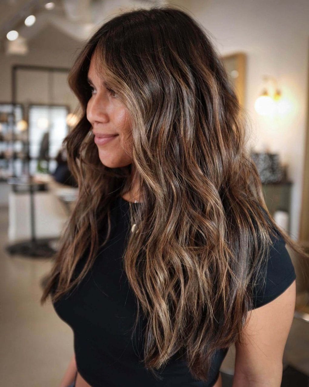 Teased balayage halo with sun-kissed highlights on hair.