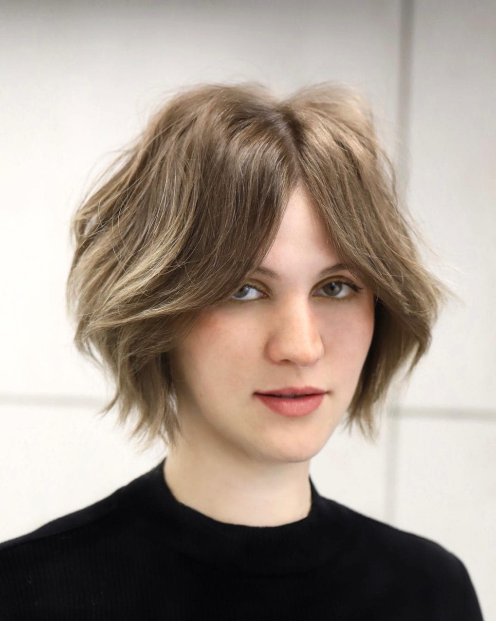 Dynamic textured bob with side-swept soft bangs