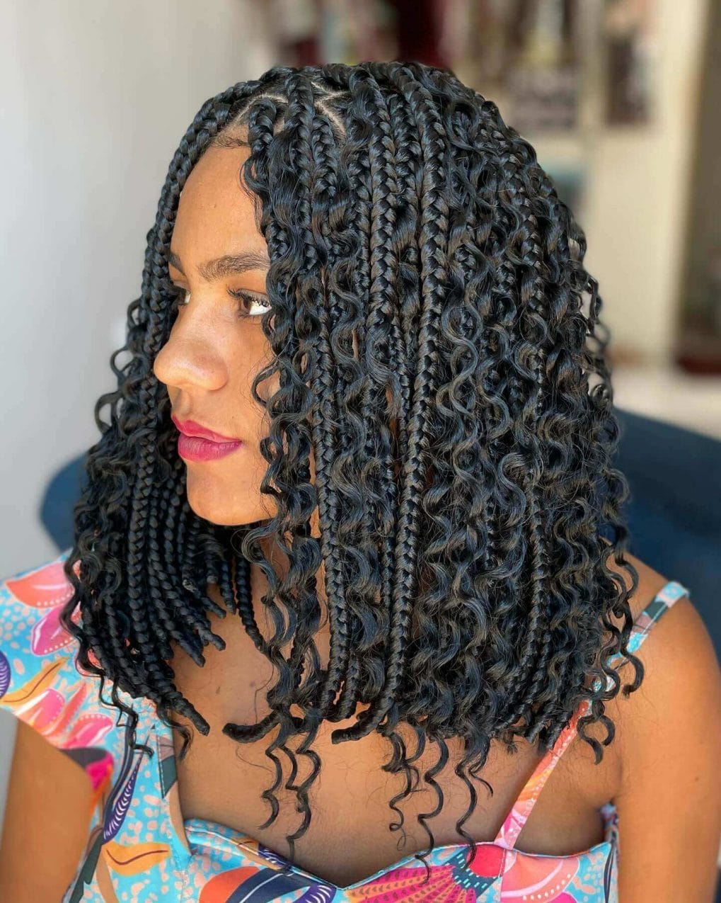 Jet-black tiny curls meet neat cornrows for a playful and practical style