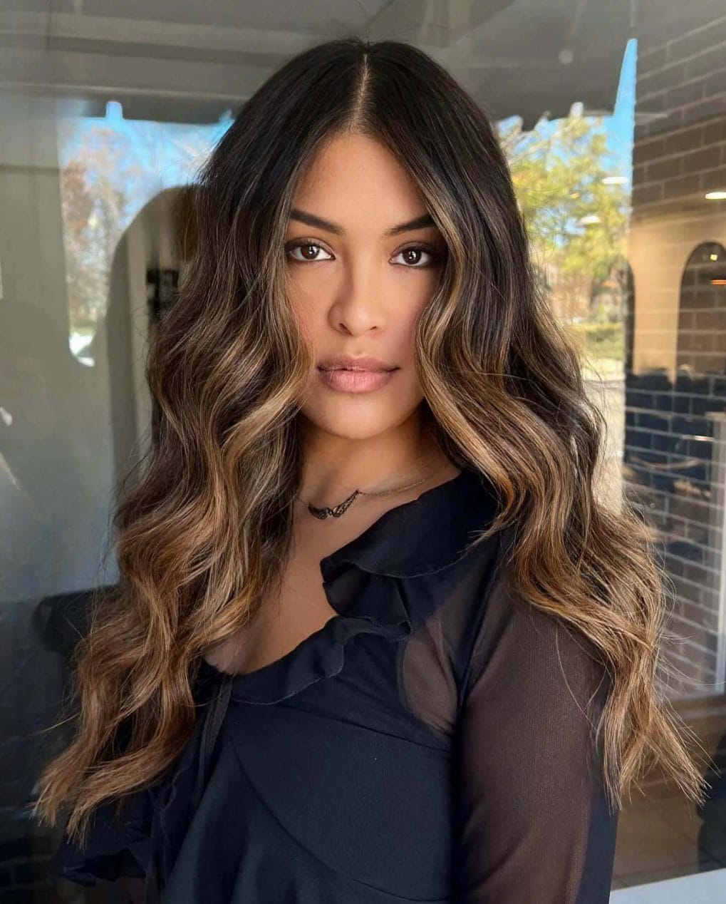 Multi-dimensional toned brunette with caramel highlights