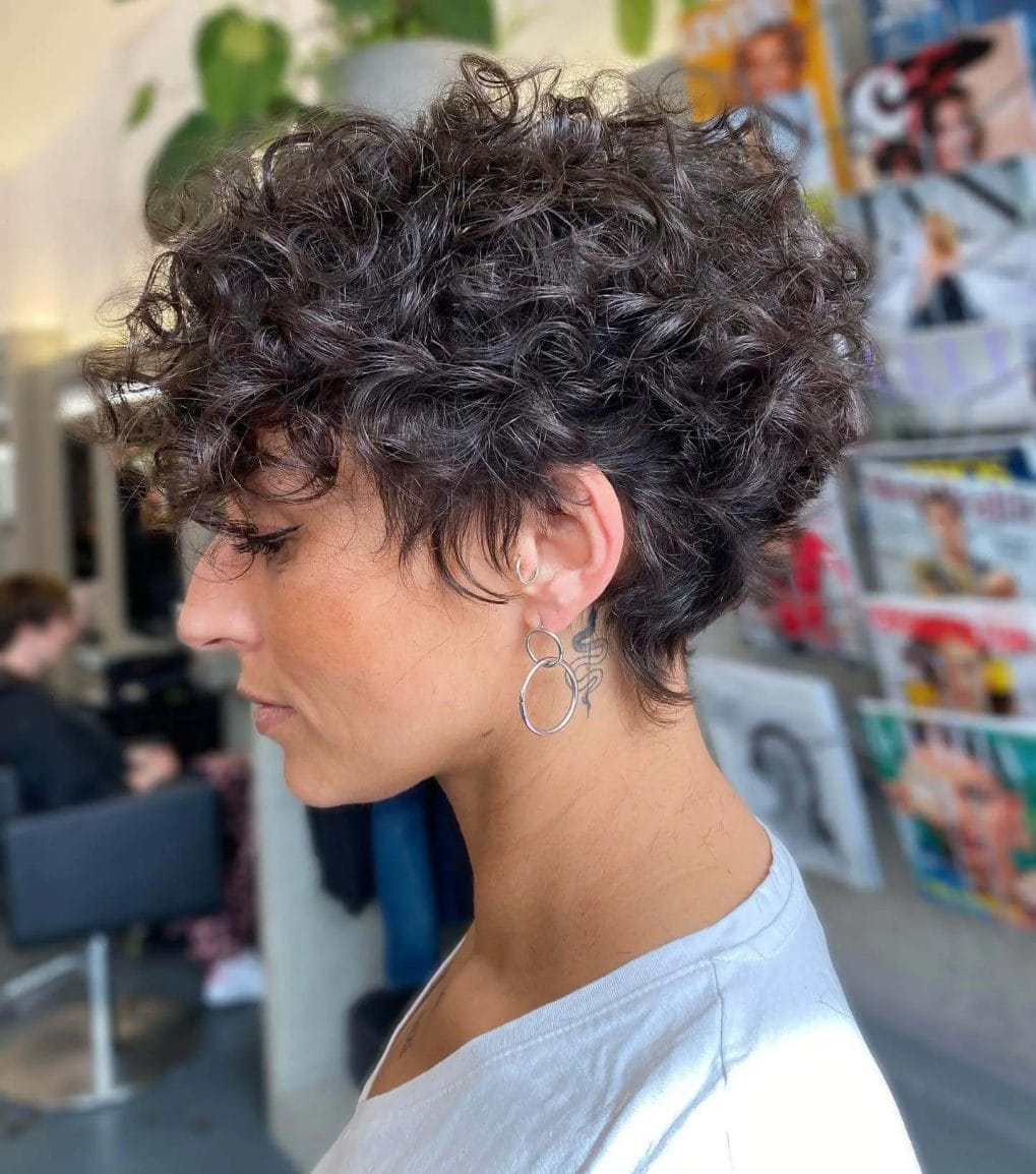 Tousled espresso pixie with cascading curls and depth.
