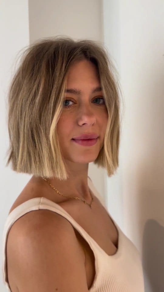Tousled layered bob with blended highlights for a beachy look